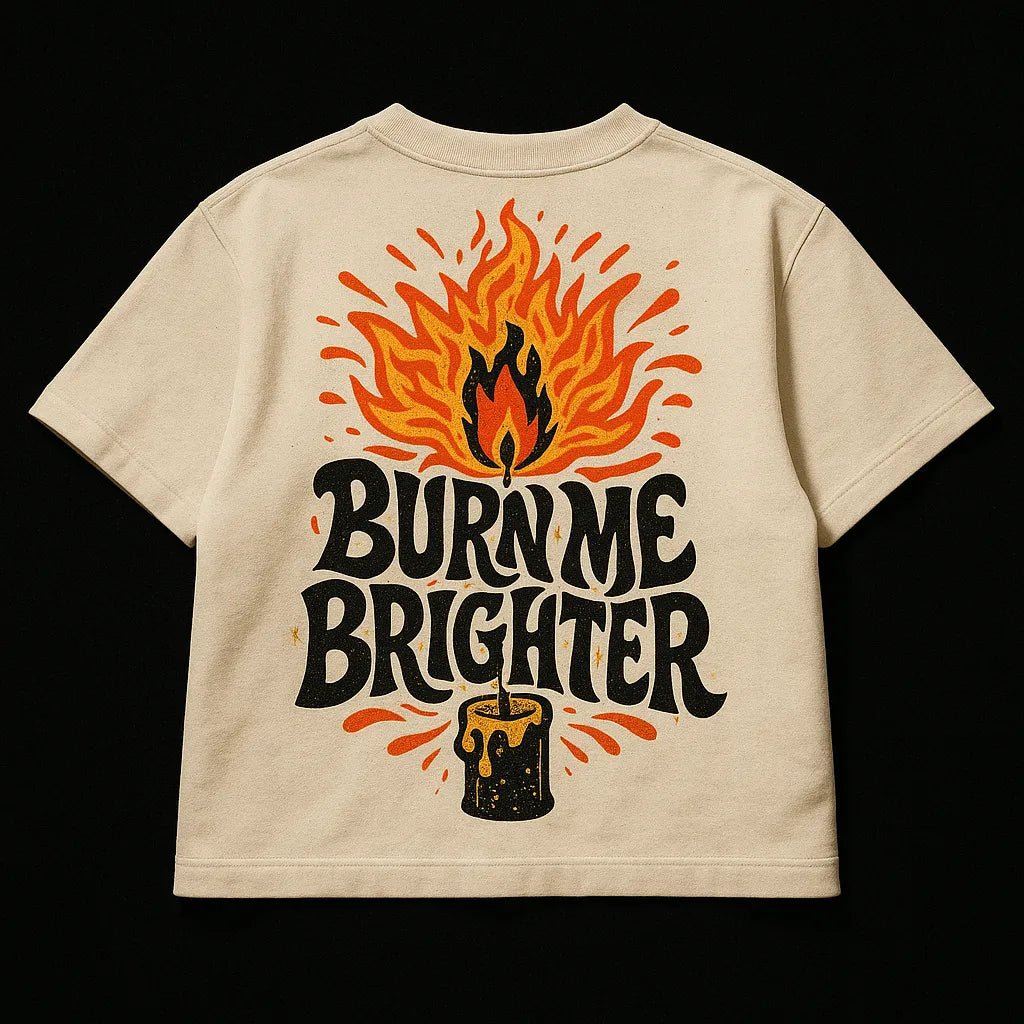 Example output from the Oversized Streetwear T Shirts Back Art ChatGPT prompt: bold graphic T-shirt mockups with screenprint-style back quotes, flat-lay perspective, and expressive pop-style illustrations on cotton fabric.Burn me Brighter.