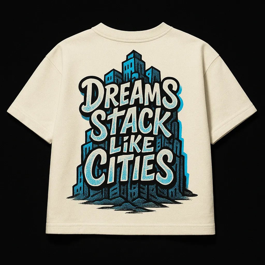 Example output from the Oversized Streetwear T Shirts Back Art ChatGPT prompt: bold graphic T-shirt mockups with screenprint-style back quotes, flat-lay perspective, and expressive pop-style illustrations on cotton fabric. Dreams Stack Like Cities.