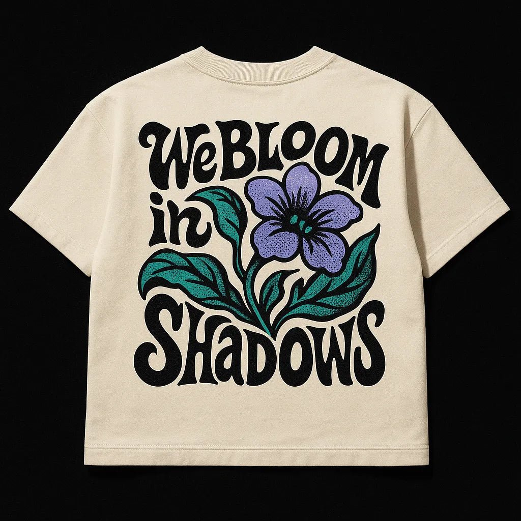 Example output from the Oversized Streetwear T Shirts Back Art ChatGPT prompt: bold graphic T-shirt mockups with screenprint-style back quotes, flat-lay perspective, and expressive pop-style illustrations on cotton fabric. We Bloom n Shadows.