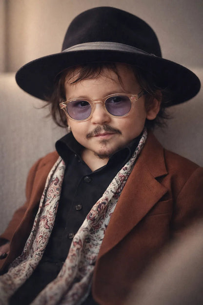 Luxury editorial baby-style portrait created from real photo, featuring high-fashion outfits, cinematic lighting, and premium studio aesthetics: Johnny