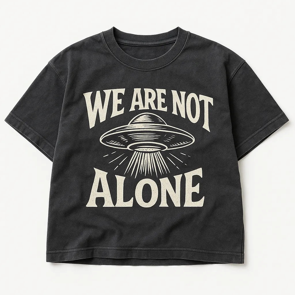 Example output from the Black Washed Streetwear T-Shirt Designs ChatGPT prompt: We are not Alone