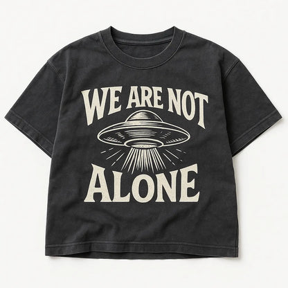 Example output from the Black Washed Streetwear T-Shirt Designs ChatGPT prompt: We are not Alone