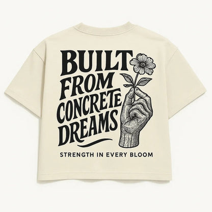 Example output from the Bold Lettered Tshirt Back Art ChatGPT prompt: oversized t-shirt graphics with bold phrases, featuring vintage-style lettering. Build from concrete dreams.