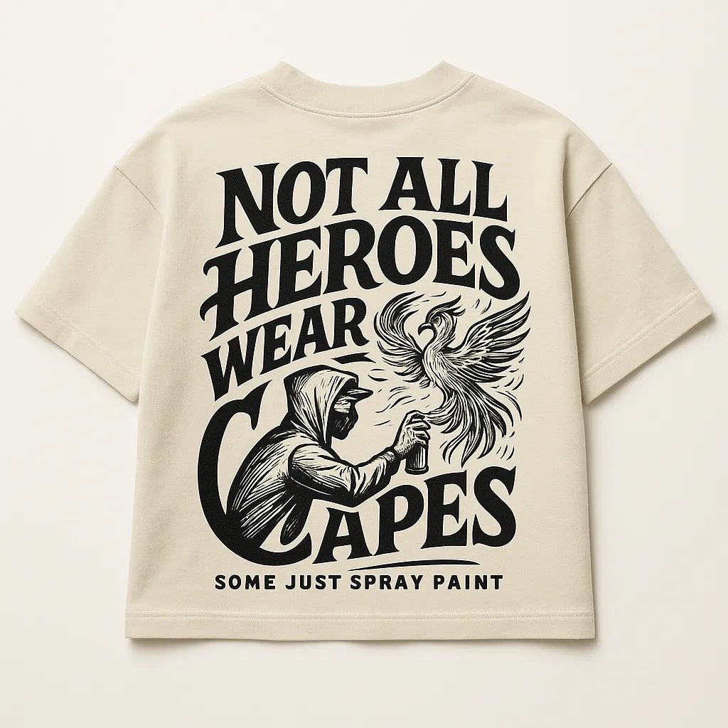 Example output from the Bold Lettered Tshirt Back Art ChatGPT prompt: oversized t-shirt graphics with bold phrases, featuring vintage-style lettering. Not all heroes wear capes.