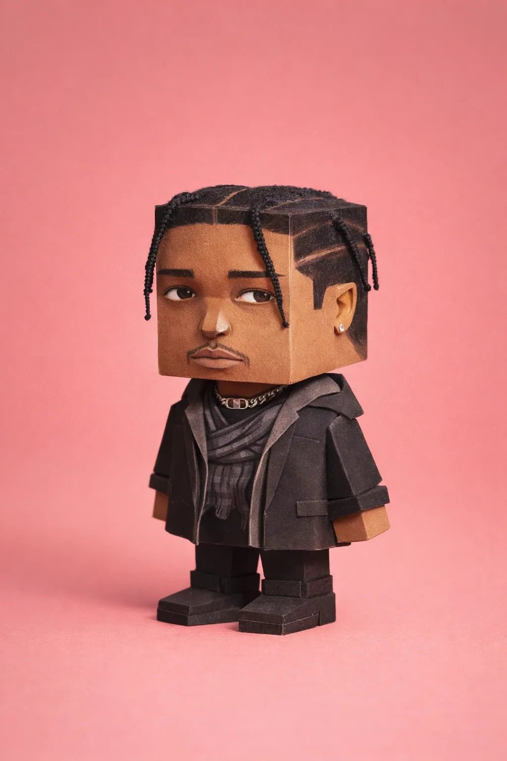 Cube-headed cardboard paper toy character on colorful studio background, showing photo-to-figure style with clean negative space: Asap