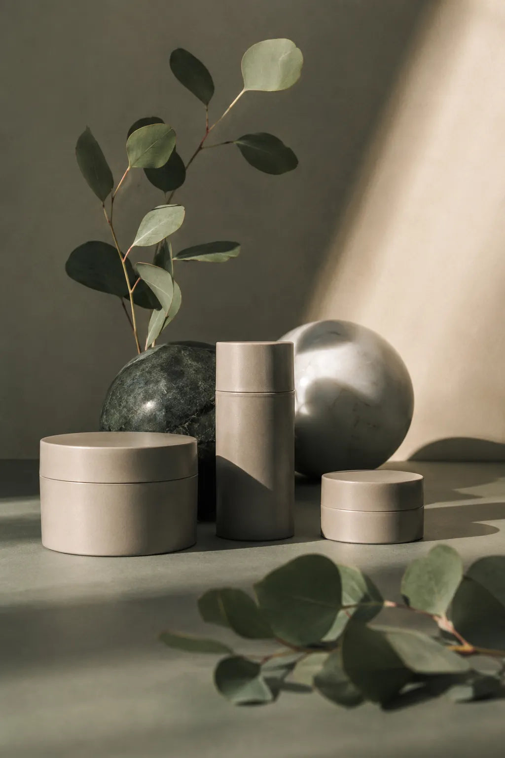Example output from the Editorial Beauty Product Photos ChatGPT prompt: a luxury editorial skincare product photo with amber oil bottles, warm sunlight and sculptural shadows in a refined minimalist composition.