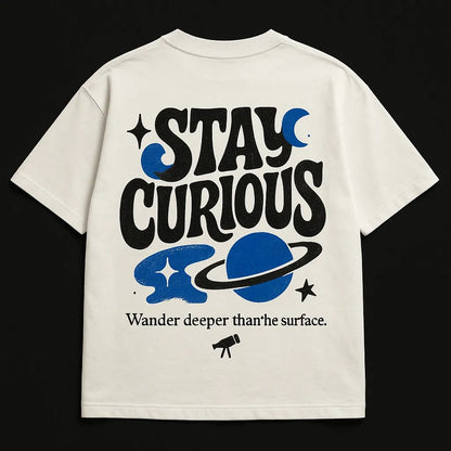 Example output from the Minimal Concept T Shirt Back Prints ChatGPT prompt: premium flat-lay T-shirt mockups with bold centered quotes, minimalist concept icons, vivid highlights, and high-resolution fabric texture rendering. Stay Curious.