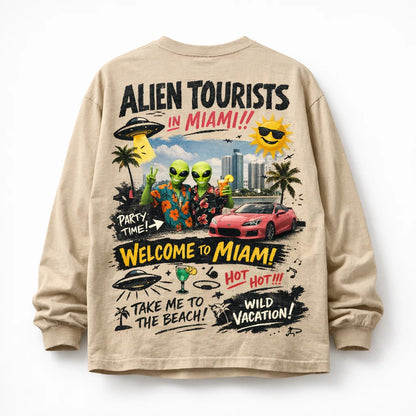 Naive Chaos Longsleeve Shirt Design. Oversized long sleeve back-graphic mockup featuring chaotic mixed-media collage, layered typography, bold icons, and screen-print texture: Alien Tourists in Miami