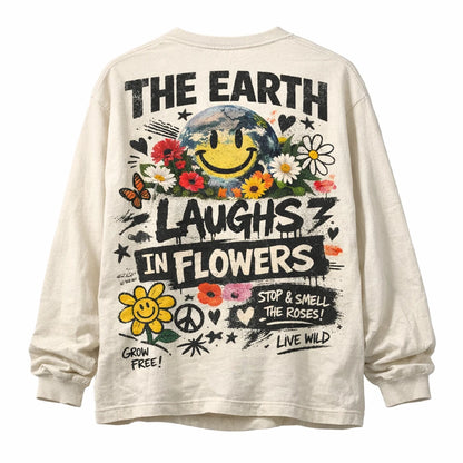 Naive Chaos Longsleeve Shirt Design. Oversized long sleeve back-graphic mockup featuring chaotic mixed-media collage, layered typography, bold icons, and screen-print texture: The Earth Laughs in Flowers
